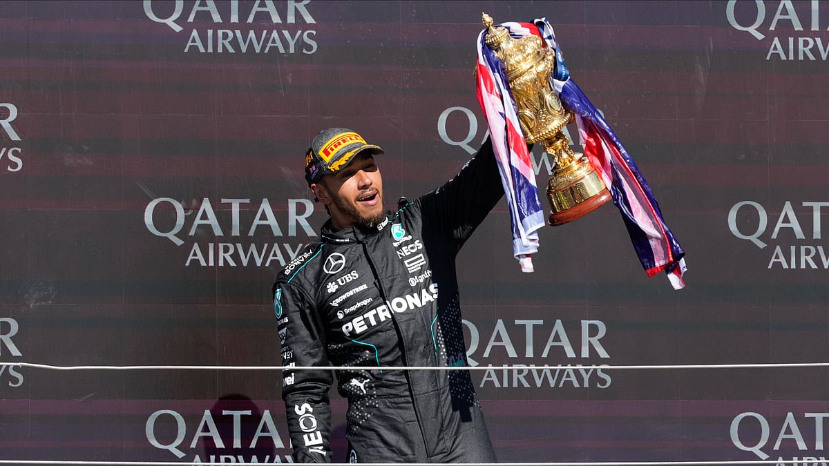 (AP Photo/Luca Bruno)


 : Mercedes driver Lewis Hamilton of Britain celebrates on the podium after winning the British Formula One Grand Prix race at the Silverstone racetrack, Silverstone, England, Sunday, July 7, 2024. 